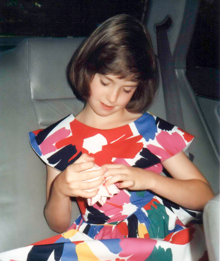 Ashley in the back of Mom's Honda.