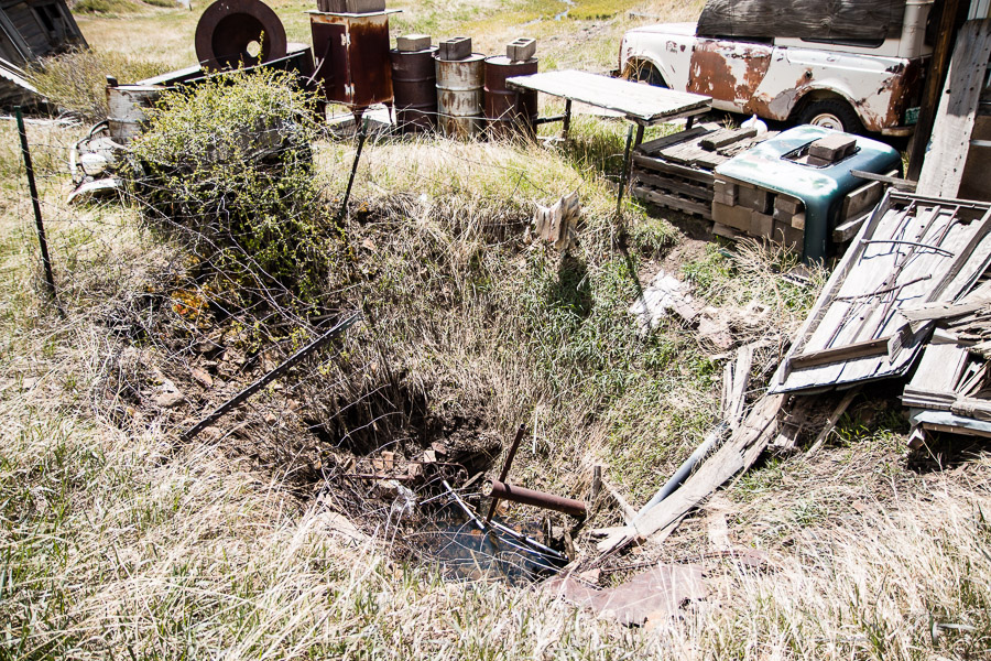 This sinkhole was about 20 feet wide, 10 deep and filled with rusty old crap.  